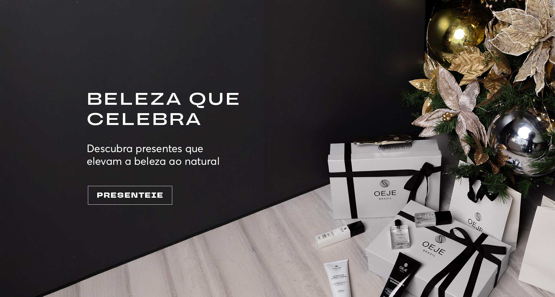Presentes de beleza OEJE Brasil: kits em caixas brancas com laços pretos, ao lado de decoração natalina.