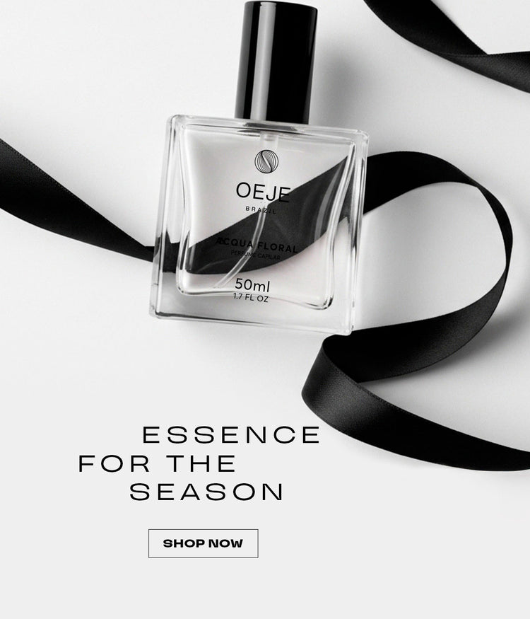Perfume capilar OEJE Brasil Acqua Floral 50ml em frasco transparente com tampa preta e fita no fundo branco.